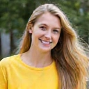 Client Emily R. smiling brightly